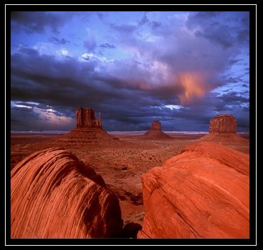 "Navajoland, Monument Valley." ©Jim Baumgardt. The two huge boulders in the foreground are gone now, replaced by a resort hotel. 