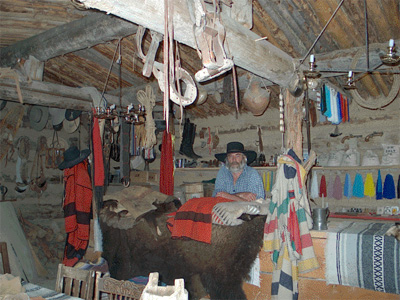 Dan Deuter's “trading post” in another rebuilt 1800’s log cabin. Both structures, along with other cabins and props are used in artists’ photoshoots he conducts each year on his property.
